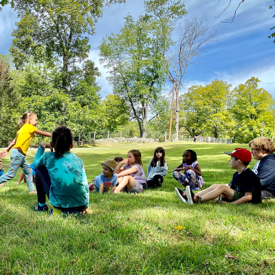 Kids play on the lawn at the Trinity Retreat Center