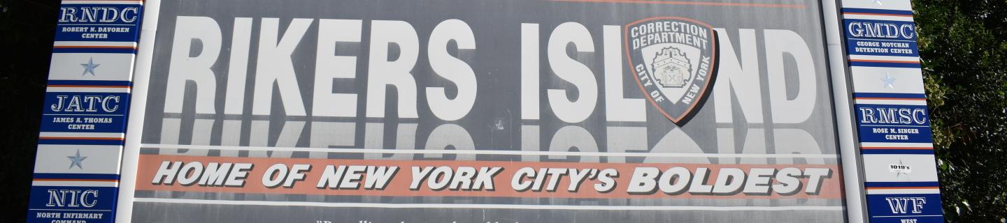 A sign that reads, "Rikers Island. Home of New York City's Boldest."