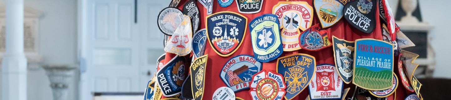 A close-up view of the 9/11 chasable vestment with patches from first responders in St. Paul's Chapel